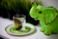 OMSK, RUSSIA, MAY 08, 2020: A small statuette in the form of an elephant of green color.