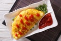 Omurice omelet stuffed with rice closeup. Horizontal top view Royalty Free Stock Photo
