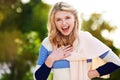 OMW Thats hilarious. Cropped portrait of a young woman laughing outdoors.