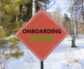 Onboarding success symbol. Concept words Onboarding success on beautiful red road sign. Beautiful forest snow blue sky background Royalty Free Stock Photo