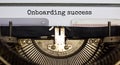 Onboarding success symbol. Words Onboarding success typed on retro typewriter. Business and onboarding success concept. Beautiful Royalty Free Stock Photo