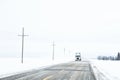 An oncoming semi truck and trailer in a winter landscape Royalty Free Stock Photo