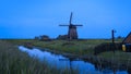 Ondermolen D windmill near Schermerhorn city in Netherlands during twilight