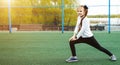 One active young girl, fit sporty child climbing, outdoor exercise, hanging on a bar on a playground, portrait, closeup. Children