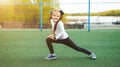 One active young girl, fit sporty child climbing, outdoor exercise, hanging on a bar on a playground, portrait, closeup. Children