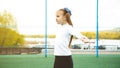 One active young girl, fit sporty child climbing, outdoor exercise, hanging on a bar on a playground, portrait, closeup. Children