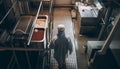 One adult male engineer walking inside steel factory with equipment generated by AI Royalty Free Stock Photo