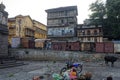 One aged lady selling coconuts in lonely area