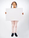 This one is for all the kids. Studio shot of an adorable little girl holding a blank placard. Royalty Free Stock Photo