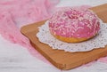 One American pink donut close-up.