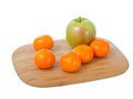 Fruits on cutting board.