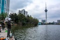 One Asian Chinese man fishing in pond