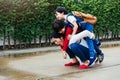 One asian mother carrying two childen kid outdoor