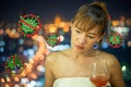 One asian woman doing Social distancing protect Covid-19 and other Contagious disease with a flute of red cocktail Royalty Free Stock Photo