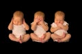 One baby three times in hear see speak no evil poses Royalty Free Stock Photo