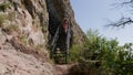 One Bald Guy Is Hiking In The Mountains On A Sunny Bright Day