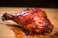 one bbq chicken drumstick bitten into, showing moist meat inside Royalty Free Stock Photo