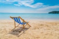 One beach chairs on the white sand with blue sky and summer sea background. Summer, Vacation, Travel and Holiday concept Royalty Free Stock Photo