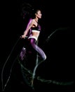 Beautiful woman jumping rope fitness exercises isolated black background Royalty Free Stock Photo