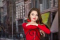 One beautiful female caucasain high school senior girl in red crop top sweater
