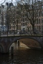 One beautiful old dutch bridge in the sunny day in autumn in the center of Amsterdam