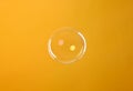 One beautiful soap bubble on orange background Royalty Free Stock Photo