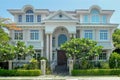 One beautiful three-story house with trees