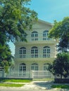 One beautiful three-story house with trees