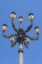 One of the beautifully decorated old lampposts on St. Peter`s Square in Rome under a clear blue sky Royalty Free Stock Photo