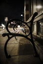 One bench at night with reflection of light