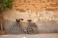 one bicycle parked against a rustic wall Royalty Free Stock Photo