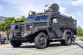 One big black Army vehicle driving through the Fourth of July Parade