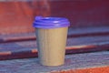 A one big brown paper cup with a purple plastic lid Royalty Free Stock Photo