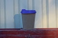 A one big brown paper cup with a purple plastic lid Royalty Free Stock Photo