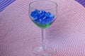 One big glass transparent goblet with blue stones Royalty Free Stock Photo
