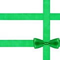 One big green bow knot on three silk ribbons Royalty Free Stock Photo