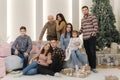 One big stylish family at Christmas eve. Portrait of noel large family gathering. Young grandparents and grandmother