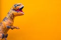 One big and tall dinosaur enjoying and having fun with orange background - copy and blank space to write your text here Royalty Free Stock Photo