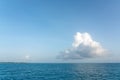 One big white cloud in blue sky over sea landscape. Cloud above ocean water panorama, horizon, beautiful tropical Royalty Free Stock Photo