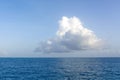 One big white cloud in blue sky over sea landscape. Cloud above ocean water panorama, horizon, beautiful tropical Royalty Free Stock Photo