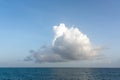 One big white cloud in blue sky over sea landscape. Cloud above ocean water panorama, horizon, beautiful tropical Royalty Free Stock Photo