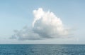 One big white cloud in blue sky over sea landscape. Cloud above ocean water panorama, horizon, beautiful tropical Royalty Free Stock Photo