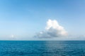 One big white cloud in blue sky over sea landscape. Cloud above ocean water panorama, horizon, beautiful tropical Royalty Free Stock Photo