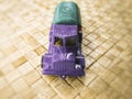 Purple toy truck isolated on a blurred background
