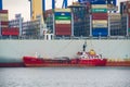 Huge 400 m long container ship mooring in cloudy day