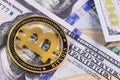 One bitcoin with dollars banknotes Royalty Free Stock Photo