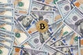 One bitcoin with hundred dollars bills Royalty Free Stock Photo