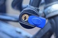 one black bicycle lock with a cable screwed on the metal frame Royalty Free Stock Photo