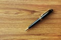 one black business pen on wood background Royalty Free Stock Photo