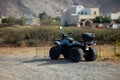 one black four-wheeled quadro cycle on nature , extreme transport